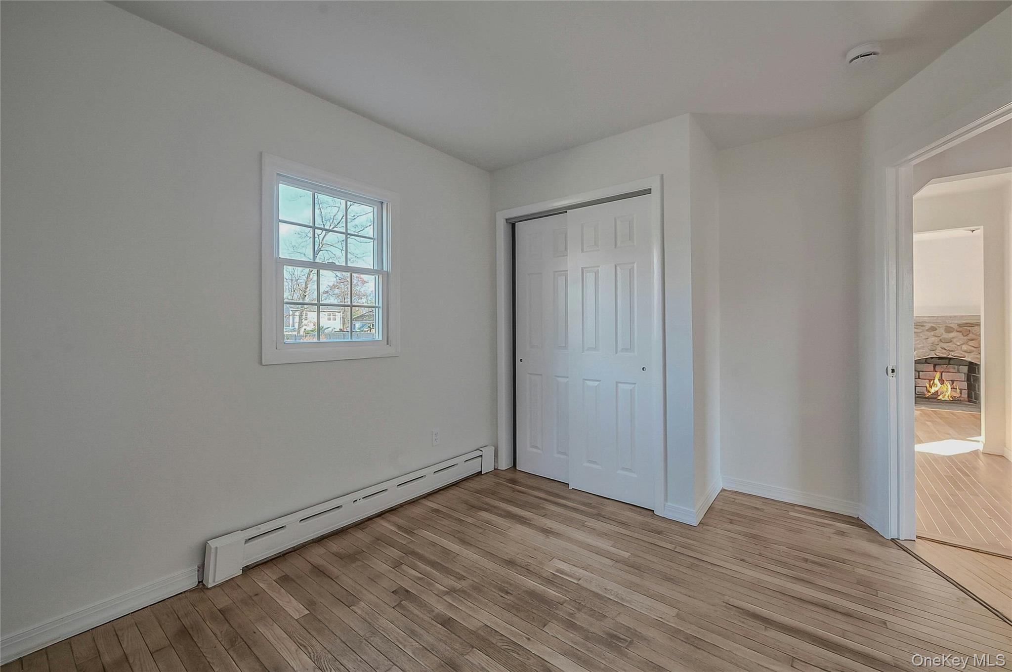 8 Pansy Road Rocky Point, NY 11778 - Photo 18 of 31 Second Bedroom On Main Floor With Hardwood Flooring & Fresh Paint