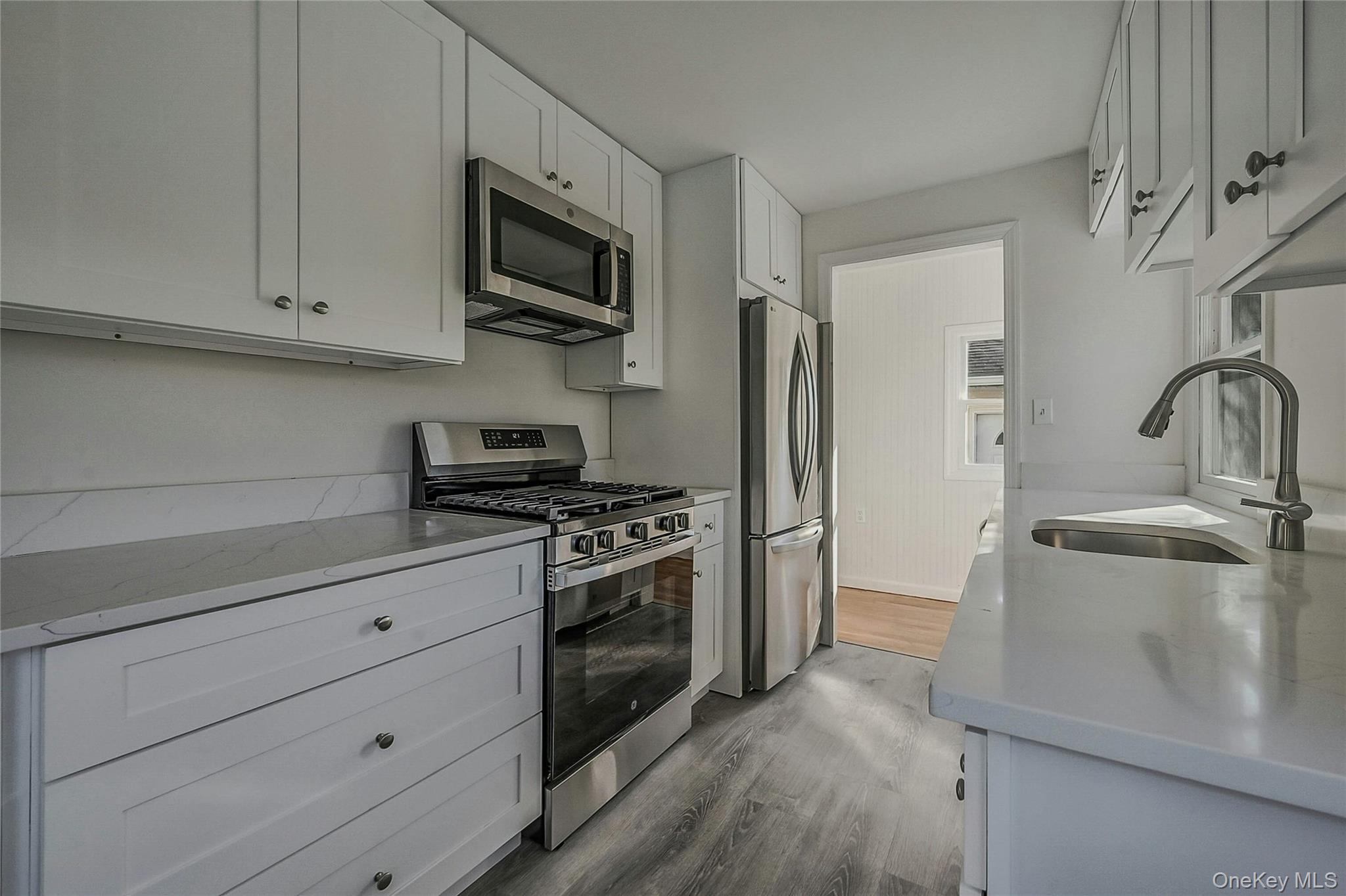 8 Pansy Road Rocky Point, NY 11778 - Photo 5 of 31 Updated White Cabinets With Matching Granite Countertops With All New Stainless Appliances