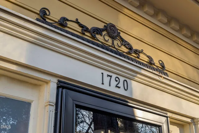 a picture of a book shelf with two white walls