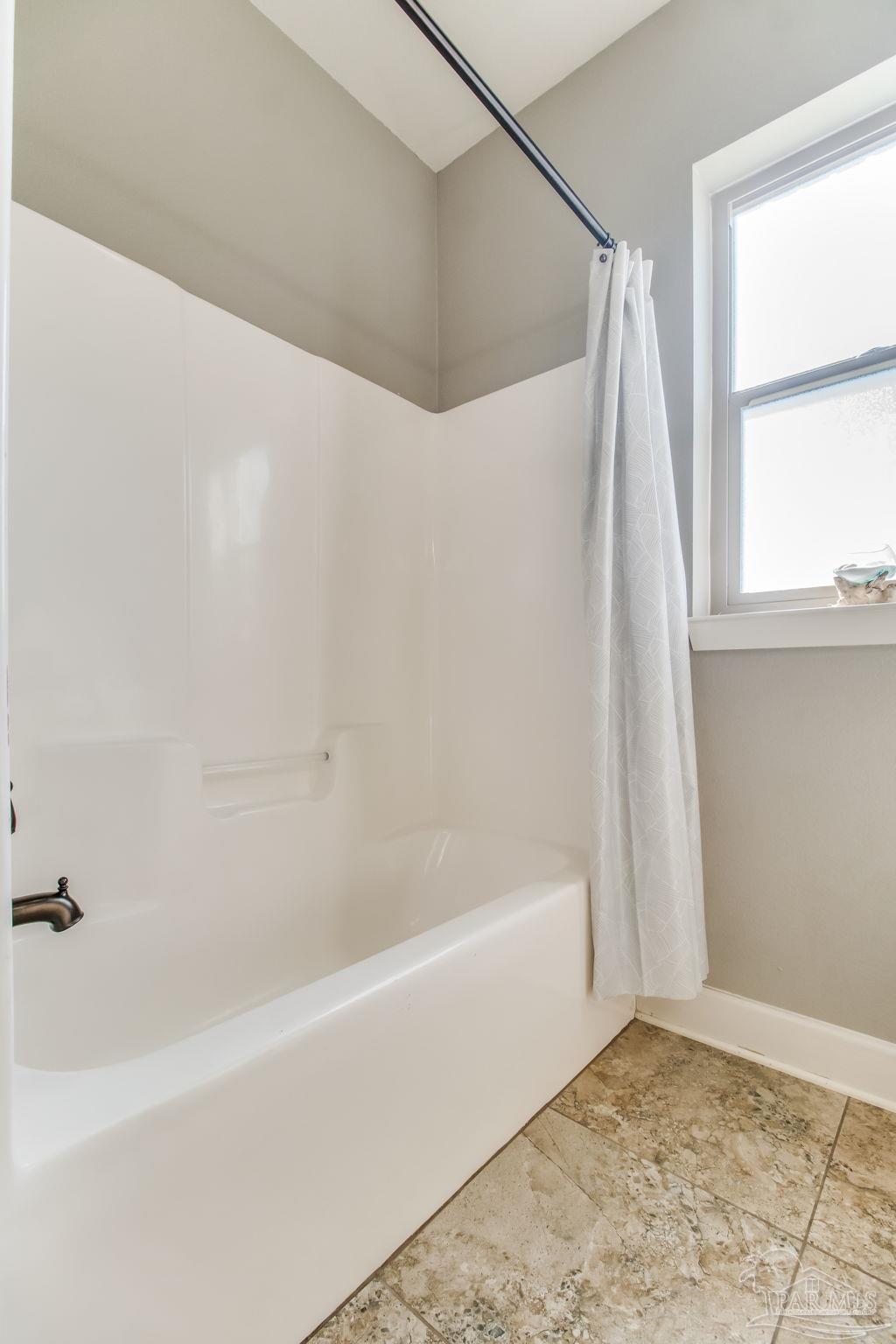 4940 Palmer Ridge Drive Milton, FL 32570 - Photo 34 of 53 a bathroom with a bathtub and a shower