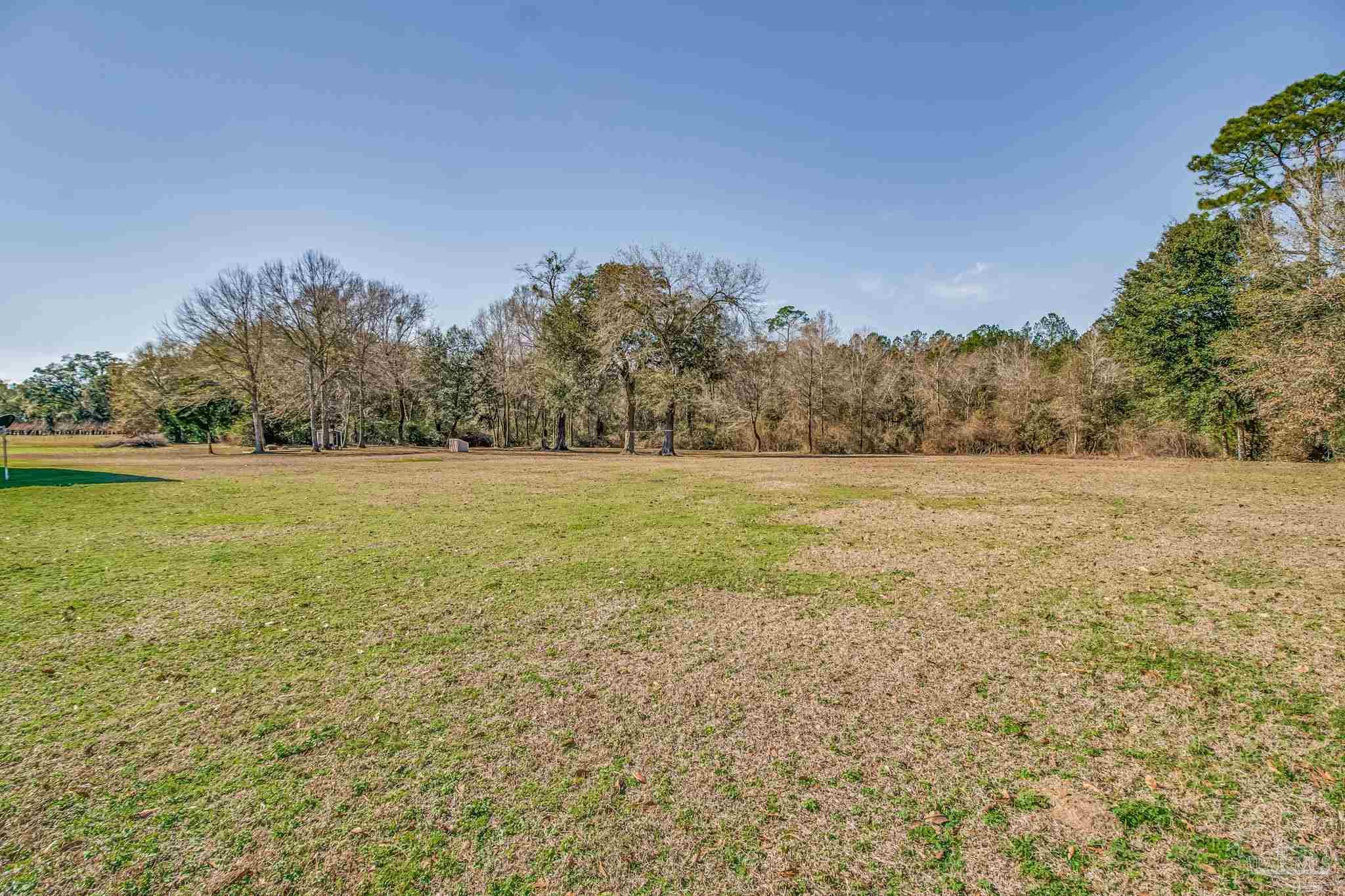 4940 Palmer Ridge Drive Milton, FL 32570 - Photo 39 of 53 a view of a field with an ocean view