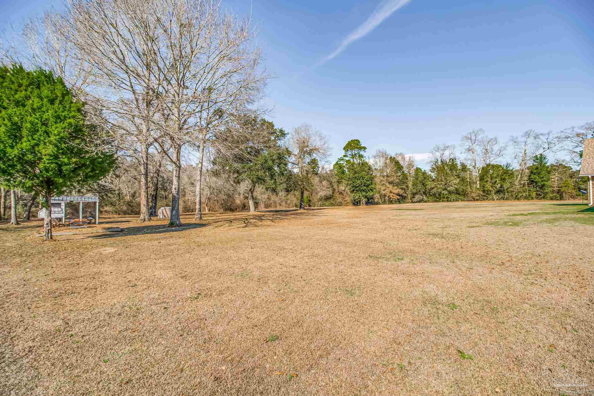 4940 Palmer Ridge Drive Milton, FL 32570 - Photo 45 of 53 a view of outdoor space with trees