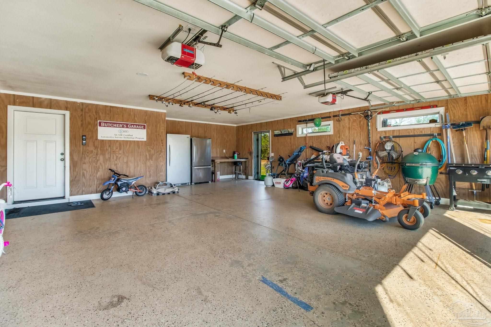 4940 Palmer Ridge Drive Milton, FL 32570 - Photo 47 of 53 a view of parking garage with cars