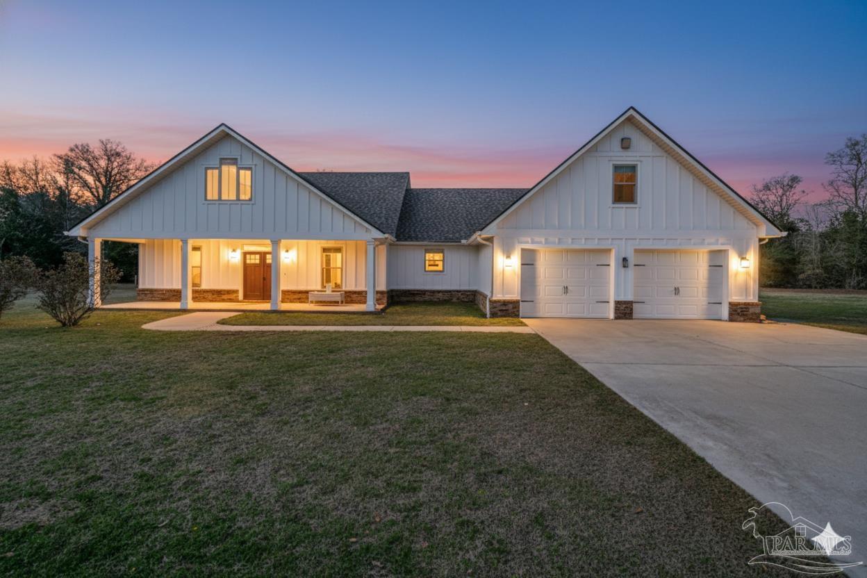 4940 Palmer Ridge Drive Milton, FL 32570 - Photo 53 of 53 a front view of a house with a yard
