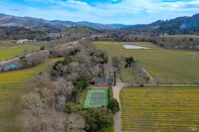 an aerial view of ocean with residential house and lake view