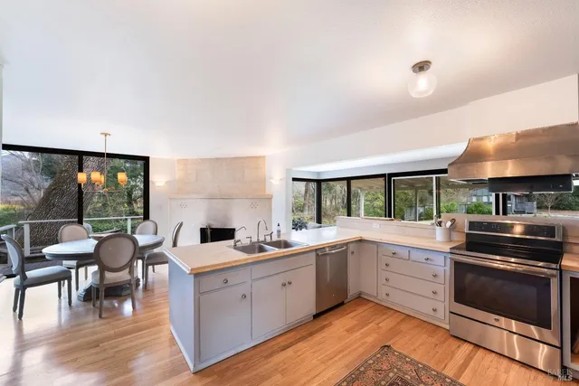 a kitchen with a sink stove and cabinets