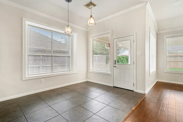 a kitchen with stainless steel appliances granite countertop a sink a stove and cabinets