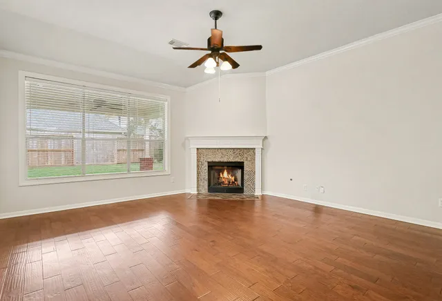 a view of an empty room with a fireplace