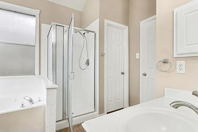 a bathroom with a sink and a bathtub