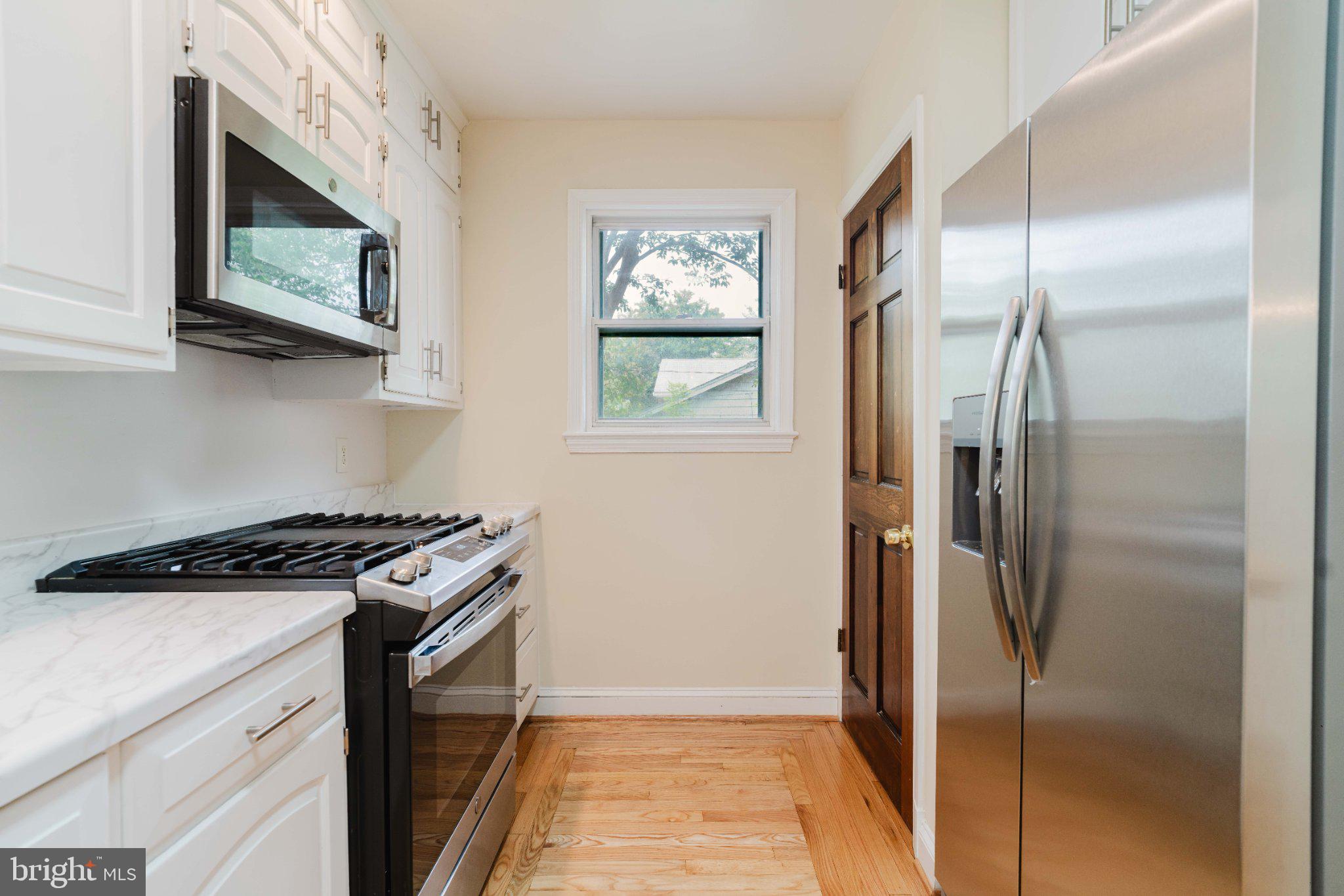 10200 Duvawn Place Silver Spring, MD 20902 - Photo 7 of 42 Bright and modern kitchen space.
