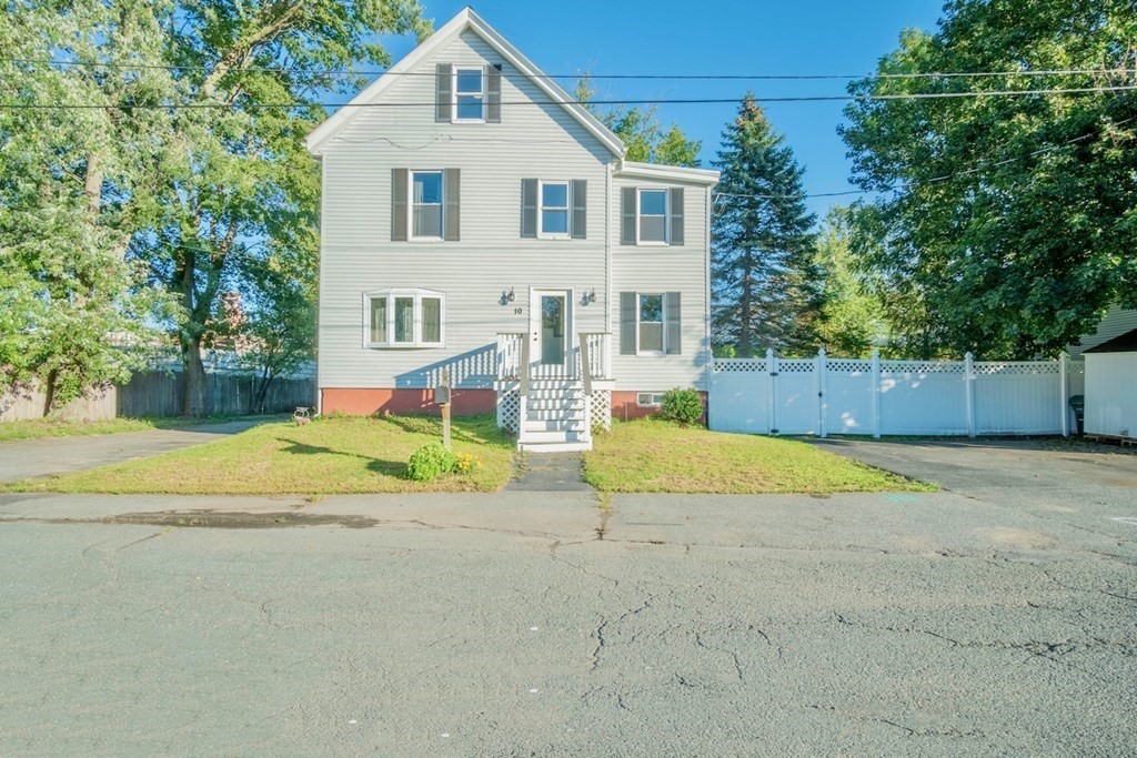a view of house with outdoor space and swimming pool