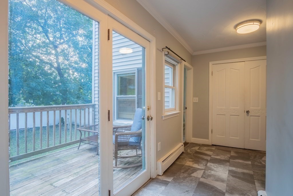 10 Maple Avenue Danvers, MA 01923 - Photo 17 of 41 an empty room with wooden floor and windows