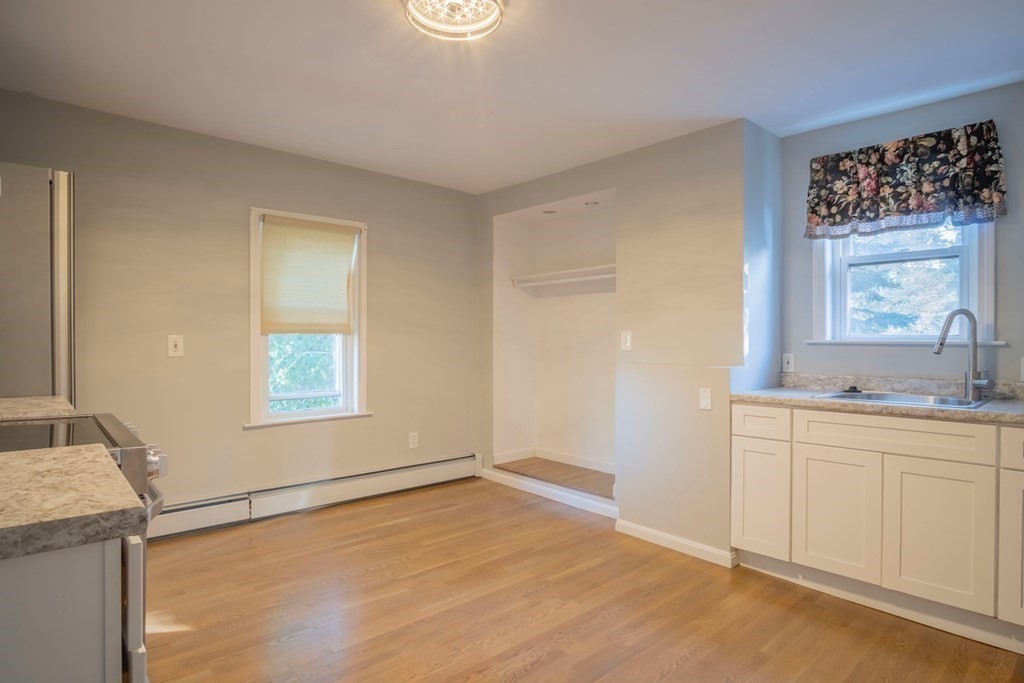10 Maple Avenue Danvers, MA 01923 - Photo 28 of 41 a view of a kitchen with a sink cabinet and a window