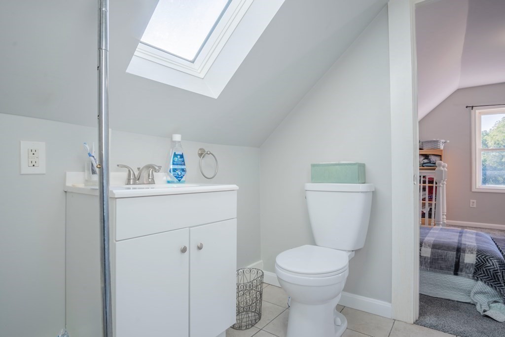 10 Maple Avenue Danvers, MA 01923 - Photo 33 of 41 a bathroom with a toilet sink and mirror