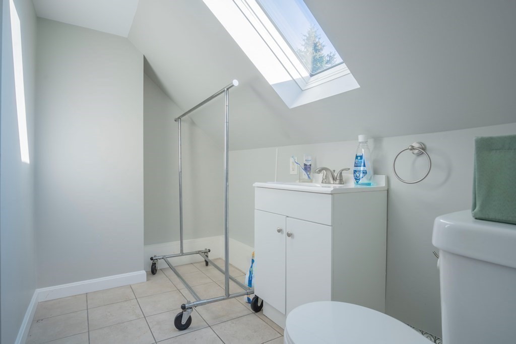 10 Maple Avenue Danvers, MA 01923 - Photo 34 of 41 a bathroom with a toilet sink and mirror