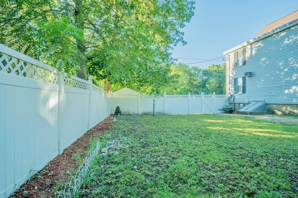 10 Maple Avenue Danvers, MA 01923 - Photo 39 of 41 a backyard of a house with lots of green space
