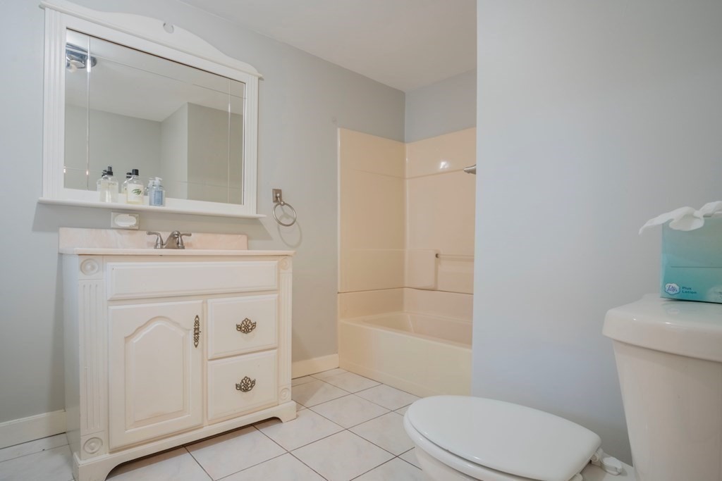 10 Maple Avenue Danvers, MA 01923 - Photo 10 of 41 a bathroom with a sink a toilet and a mirror