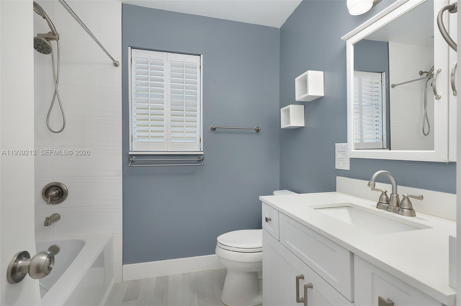 22300 Sands Point Drive Boca Raton, FL 33433 - Photo 12 of 17 a bathroom with a sink a toilet and shower