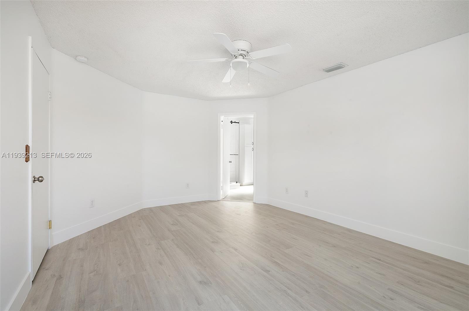 22300 Sands Point Drive Boca Raton, FL 33433 - Photo 7 of 17 a view of an empty room with wooden floor