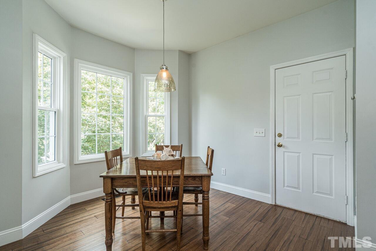 3008 Agent Court Raleigh, NC 27603 - Photo 11 of 28 Enjoy your morning coffee here as you look out the beautiful bay window! Access to the garage is to the right!