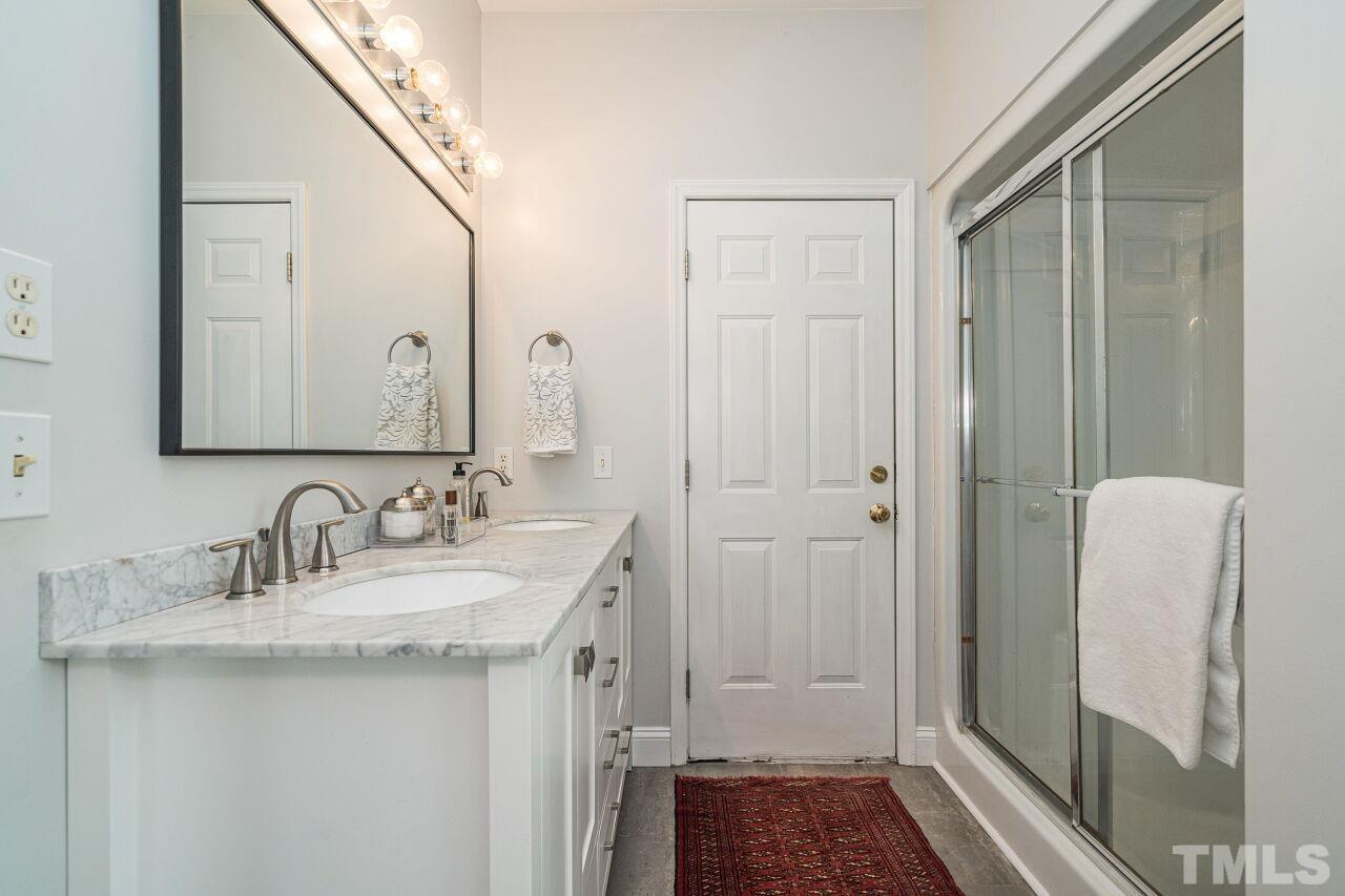 3008 Agent Court Raleigh, NC 27603 - Photo 16 of 28 Master bath has access to the outdoor deck!
