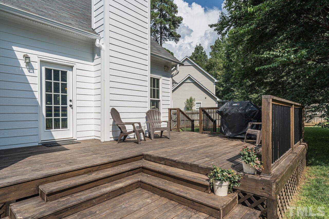 3008 Agent Court Raleigh, NC 27603 - Photo 23 of 28 You will LOVE hanging out on the back deck! Seller replaced deck boards, railings, steps, stained and refinished deck in 2020/2021!