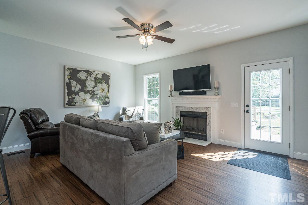 3008 Agent Court Raleigh, NC 27603 - Photo 5 of 28 Spacious family room with fireplace!