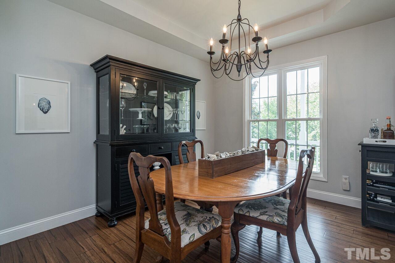 3008 Agent Court Raleigh, NC 27603 - Photo 6 of 28 Perfect place to entertain friends and family! Note the tray ceiling and stylish chandelier!