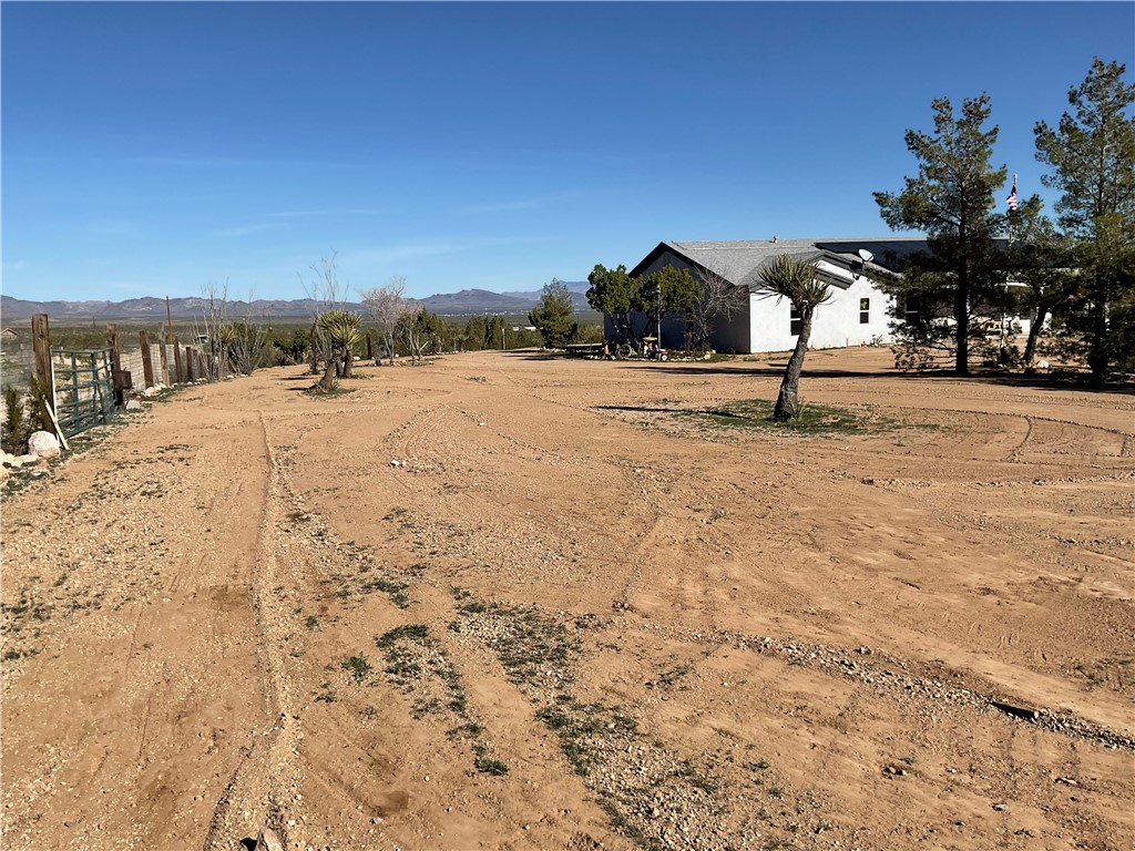 1790 Gleeson Road Golden Valley, AZ 86413 - Photo 39 of 62 View of yard with a mountain view and a view of countryside