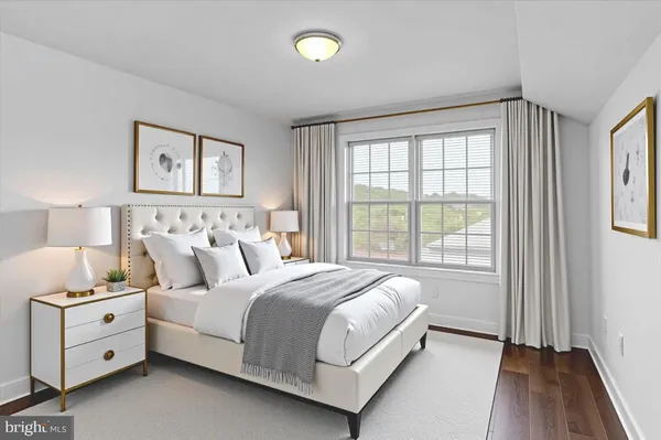 a bed room with a bed and a window