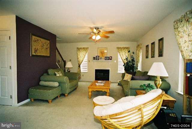 68 Test Road Hanover, PA 17331 - Photo 3 of 9 a living room with furniture a fireplace and a chandelier
