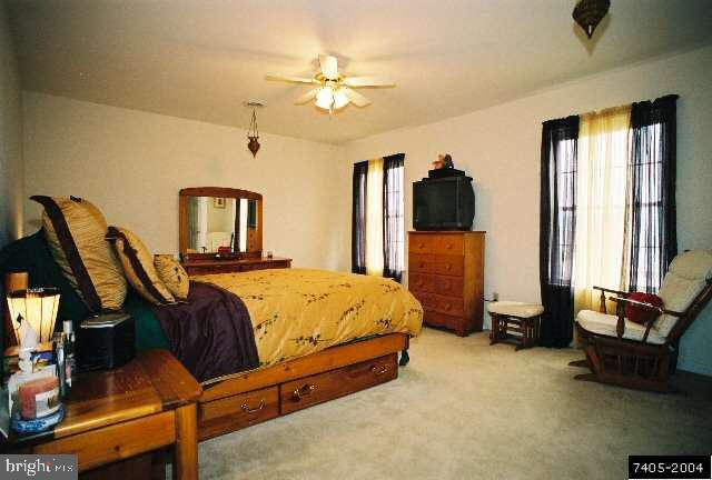 68 Test Road Hanover, PA 17331 - Photo 5 of 9 a bed room with a bed and a chandelier