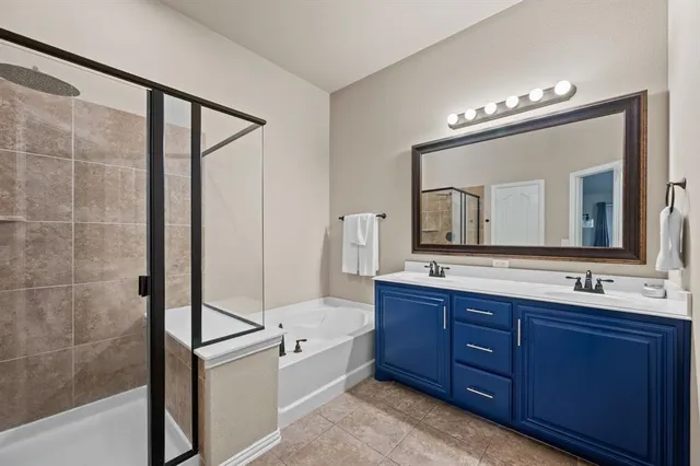 a utility room with sink dryer and washer