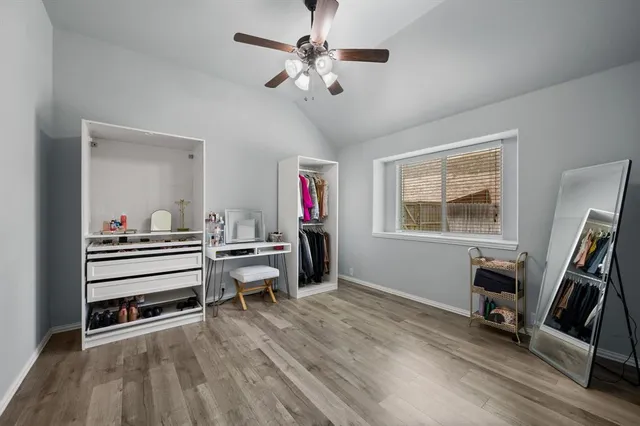 a bathroom with a sink vanity mirror and toilet