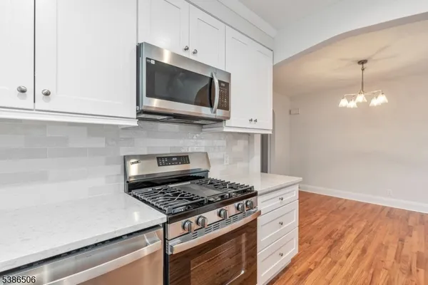 a kitchen with a stove and a microwave