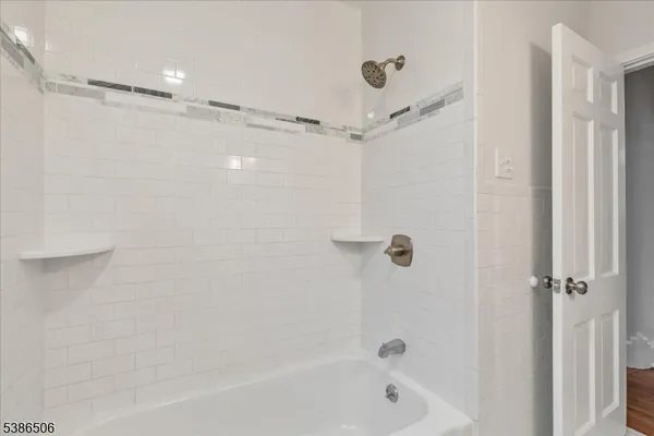 a bathroom with a shower and a bathtub