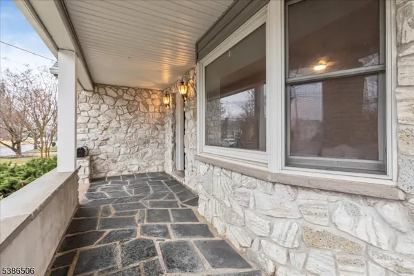 a front view of a house with a glass door