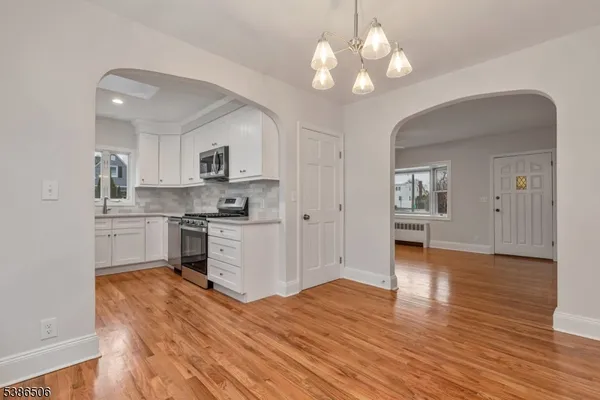 a kitchen with a refrigerator and cabinets