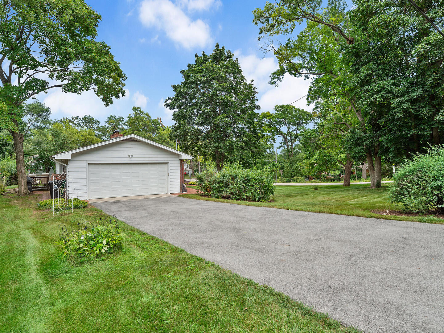 S374 Summit Drive Winfield, IL 60190 - Photo 17 of 17 a view of a house with a yard and large trees