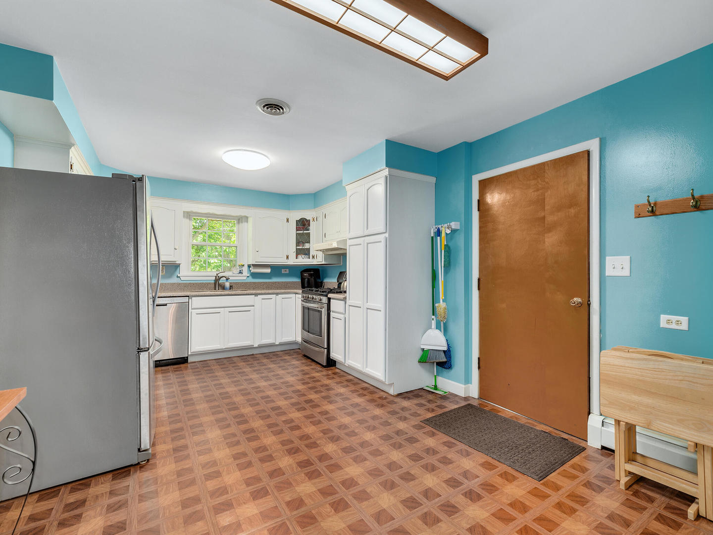 S374 Summit Drive Winfield, IL 60190 - Photo 5 of 17 a kitchen with a refrigerator and white cabinets