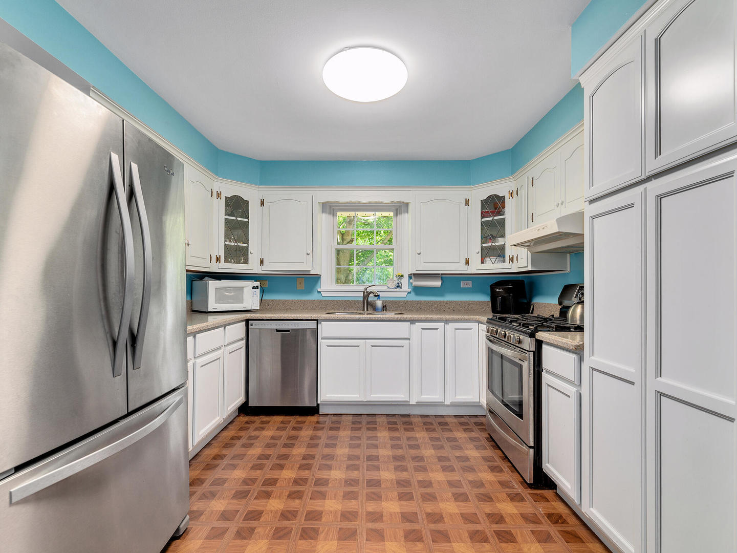 S374 Summit Drive Winfield, IL 60190 - Photo 6 of 17 a kitchen with stainless steel appliances granite countertop a refrigerator sink and stove