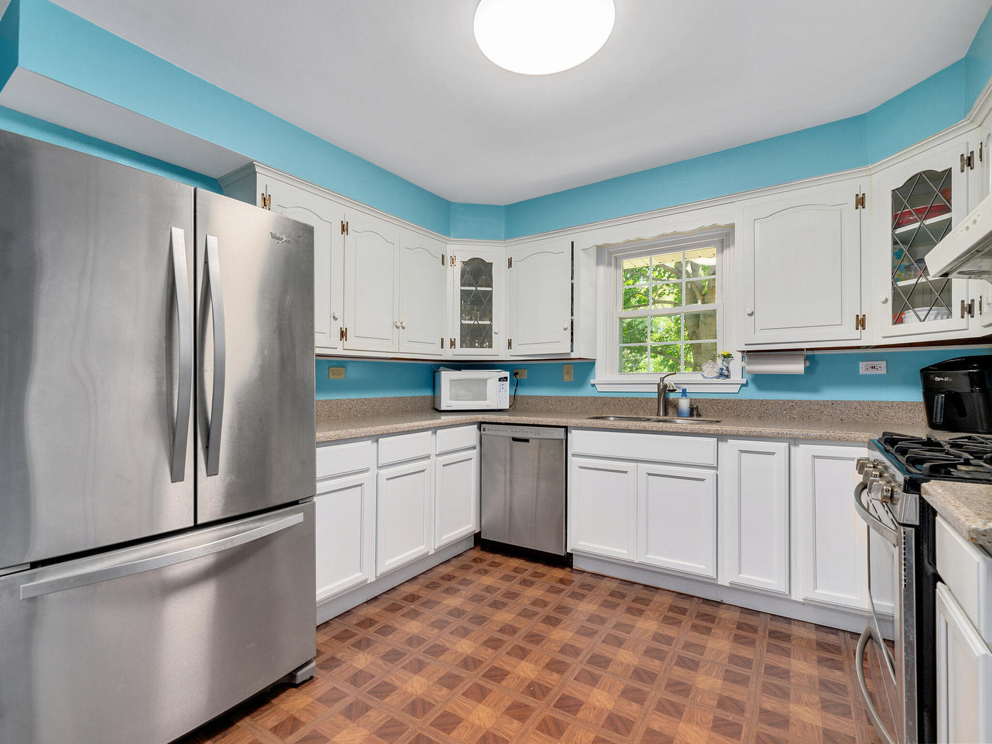 S374 Summit Drive Winfield, IL 60190 - Photo 7 of 17 a kitchen with stainless steel appliances granite countertop a refrigerator sink and stove
