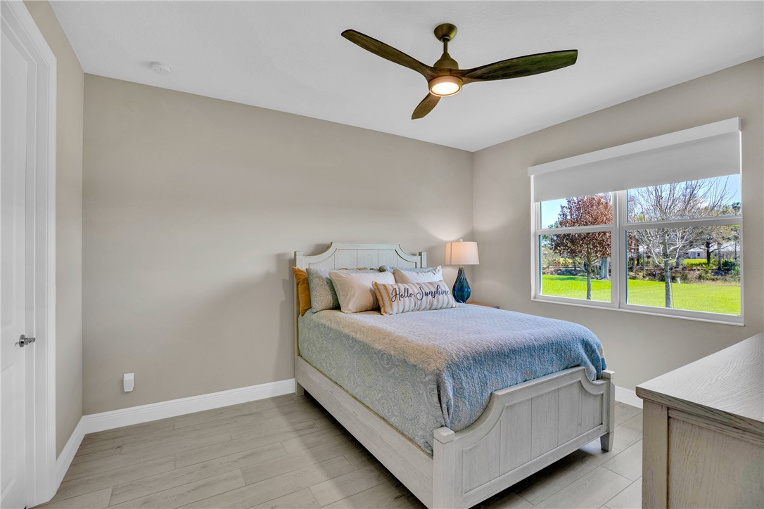 105 Night Hawk Way Sebastian, FL 32958 - Photo 22 of 36 a bedroom with a bed and window