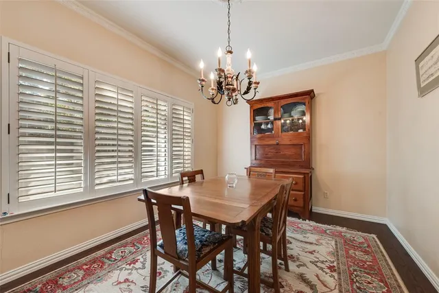 a view of a dining room with furniture and window