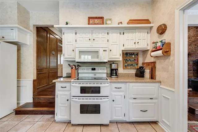a kitchen with stainless steel appliances a stove and a refrigerator