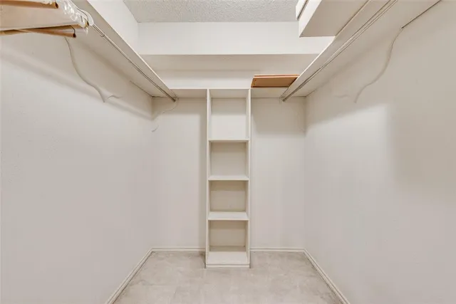a view of an empty walk in closet