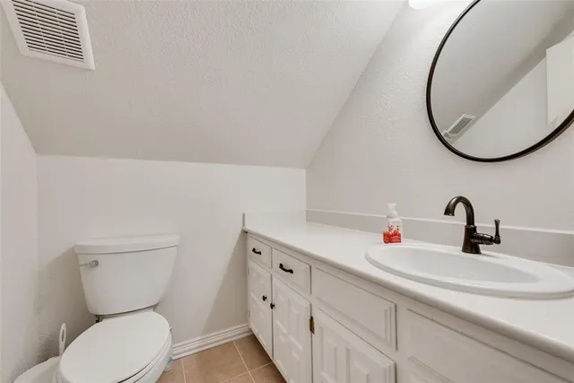 a bathroom with a toilet and a sink