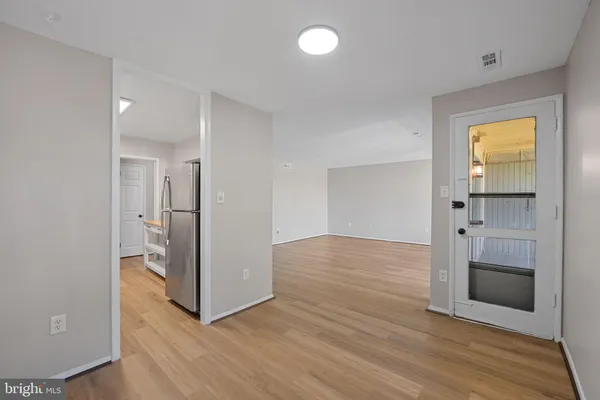 a view of a balcony with wooden floor