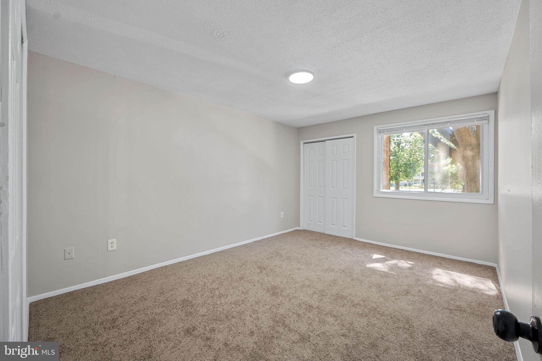 7204 Donnell Place, Unit C5 District Heights, MD 20747 - Photo 27 of 27 an empty room with windows
