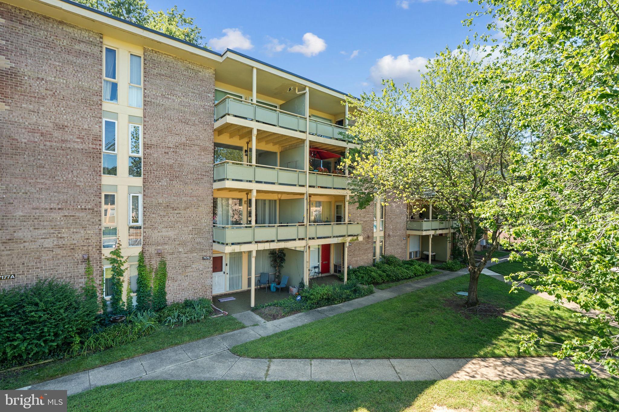 7204 Donnell Place, Unit C5 District Heights, MD 20747 - Photo 3 of 27 a front view of a building with a garden